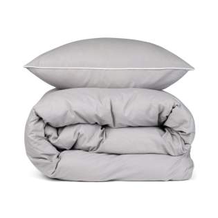 This elegant set features a solid colour design with piping detail in contrasting colour along the edges, adding a touch of sophistication to your bedding ensemble. Complete with two pillowcases (50x60 cm) and two duvet covers (150x210 cm), it ensures a coordinated and chic look for your bed. The Organic Content Standard (OCS) verifies organically grown material and tracks it from source to final product. This product contains 98% OCS certified organic cotton. This elegant set features a solid colour design with piping detail in contrasting colour along the edges, adding a touch of sophistication to your bedding ensemble. Complete with two pillowcases (50x60 cm) and two duvet covers (150x210 cm), it ensures a coordinated and chic look for your bed. The Organic Content Standard (OCS) verifies organically grown material and tracks it from source to final product. This product contains 98% OCS certified organic cotton.