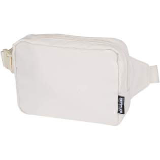 The Trip Aware™ recycled travel crossbody bag is a compact and functional bag designed for daily use and light travel. Made from durable 290D twill polyester with a knitted backing and lined with RPET 210D/PU, it features a clean, streamlined shape with practical storage options. The main zipped compartment holds your everyday essentials, while the back zipped pocket includes a ribbon for keys, as well as dedicated slots for pens and a passport. The adjustable strap with buckle ensures a secure and comfortable fit during movement. Each bag also comes with an Aware™ tracer. This innovative feature allows users to trace the origins and journey of their item through a QR code, enhancing transparency in the supply chain and fostering a stronger connection between the product and its production process. Volume capacity: 1 litre.