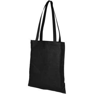Need a good bag for any fair or conference? The Zeus large non-woven tote bag is a perfect option. Its slim design makes it an elegant model and suitable for carrying lightweight items like a notebook and a pen. The handles are 29 cm long and therefore easy to carry over the shoulder. Resistance up to 5 kg weight.