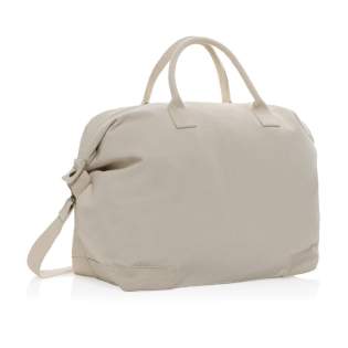 Sac week-end fabriqué en toile de coton recyclé de 500 g/m². Il présente de jolis détails, des accessoires en laiton et un compartiment principal spacieux. Parfait pour ceux qui recherchent un sac de voyage de haute qualité et à faible impact. Avec le traceur AWARE™ qui valide l'utilisation authentique de coton recyclé. 2 % des recettes de chaque produit Impact vendu seront reversés à Water.org.<br /><br />PVC free: true Sac week-end fabriqué en toile de coton recyclé de 500 g/m². Il présente de jolis détails, des accessoires en laiton et un compartiment principal spacieux. Parfait pour ceux qui recherchent un sac de voyage de haute qualité et à faible impact. Avec le traceur AWARE™ qui valide l'utilisation authentique de coton recyclé. 2 % des recettes de chaque produit Impact vendu seront reversés à Water.org.<br /><br />PVC free: true