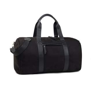 Travel in style with Marlow RCS-certified recycled polyester weekend bag. Stay organised on-the-go with this weekend bag designed for 2-3 days weekend or business trip. Features one interior pocket secured with a zipper and an exterior zipped pocket. Equipped with a detachable and adjustable shoulder strap. The Marlow series crafted from recycled faux suede with PU details and lining in recycled polyester. Finished with sleek silver hardware. Certified by RCS (Recycled Claim Standard), RSC certification guarantees that the entire supply chain of recycled materials is certified. The total recycled content is based on the overall product weight. This product contains 43% RCS certified recycled polyester and 3% RCS certified recycled polyurethane. Travel in style with Marlow RCS-certified recycled polyester weekend bag. Stay organised on-the-go with this weekend bag designed for 2-3 days weekend or business trip. Features one interior pocket secured with a zipper and an exterior zipped pocket. Equipped with a detachable and adjustable shoulder strap. The Marlow series crafted from recycled faux suede with PU details and lining in recycled polyester. Finished with sleek silver hardware. Certified by RCS (Recycled Claim Standard), RSC certification guarantees that the entire supply chain of recycled materials is certified. The total recycled content is based on the overall product weight. This product contains 43% RCS certified recycled polyester and 3% RCS certified recycled polyurethane.
