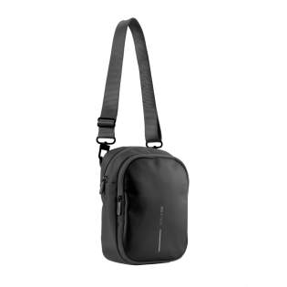 The Boxy Sling is a versatile cross body bag, designed to carry everyday essentials. The pack can be worn around the neck, over the shoulder or around the waist. It has enough capacity to hold a cellphone, wallet or purse, passport, notebook and various other small items. The hidden rear pocket is perfect for discreetly storing cash, cards or other valuable items. The Boxy Sling has a unique hidden water bottle pocket that can stay tucked away when not in use. Made from R-pet fabric with the AWARE™ tracer. With AWARE™, the use of genuine recycled fabric is guaranteed. 27% recycled content.<br /><br />PVC free: true The Boxy Sling is a versatile cross body bag, designed to carry everyday essentials. The pack can be worn around the neck, over the shoulder or around the waist. It has enough capacity to hold a cellphone, wallet or purse, passport, notebook and various other small items. The hidden rear pocket is perfect for discreetly storing cash, cards or other valuable items. The Boxy Sling has a unique hidden water bottle pocket that can stay tucked away when not in use. Made from R-pet fabric with the AWARE™ tracer. With AWARE™, the use of genuine recycled fabric is guaranteed. 27% recycled content.<br /><br />PVC free: true
