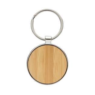 Ronde sleutelhanger gemaakt van RCS-gerecycled zinc alloy en bamboe. Totaal gerecycled materiaal: 73% op basis van het totale gewicht van het item. RCS-certificering zorgt voor een volledig gecertificeerde toeleveringsketen van de gerecyclede materialen. Verpakt in papieren zak Ronde sleutelhanger gemaakt van RCS-gerecycled zinc alloy en bamboe. Totaal gerecycled materiaal: 73% op basis van het totale gewicht van het item. RCS-certificering zorgt voor een volledig gecertificeerde toeleveringsketen van de gerecyclede materialen. Verpakt in papieren zak