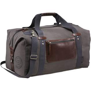 Exclusive design duffel, made of cotton canvas, features a large main compartment and unique Field & Co.™ details. Vinyl accents, front zippered pocket and durable handles. Sides can clip down when you are carrying less, or you can unclip the sides when the bag is fully stuffed. Also features trolley pass-through.