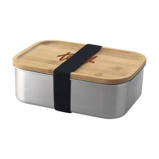 Boîte à lunch en acier inoxydable avec couvercle en bambou. La boîte à lunch est  livrée avec bande élastique amovible en polyester pour la fermeture. Un produit durable et respectueux de l'environnement. Chaque article est fourni dans une boite individuelle en papier kraft marron.