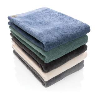These large spa-quality sustainable bath towels of 500 grams are delightfully thick, silky, and super soft to your skin. The luxurious Ukiyo towels are ultra-soft, quick-drying, and offer great absorbency. This towel contains 30% Recycled cotton and is super soft and silky to the touch. With AWARE™ tracer that validates the genuine use of recycled cotton. Each towel saves 1453.1 litres of water. 2% of proceeds of each Impact product sold will be donated to Water.org. Machine washable. Made in Portugal. OEKO-TEX® STANDARD 100. 2306130 Centexbel.