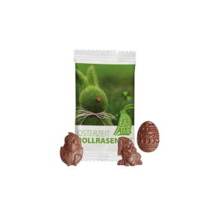 Papieren zakje met fullcolour bedrukking, gevuld met 1 chocolade paasfiguur van ca. 8,5 gr. Figuren in een mix van paashaas, paasei en kuiken Papieren zakje met fullcolour bedrukking, gevuld met 1 chocolade paasfiguur van ca. 8,5 gr. Figuren in een mix van paashaas, paasei en kuiken
