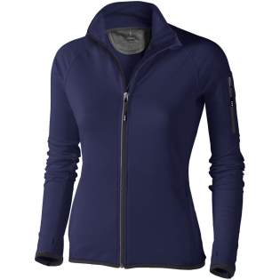 The Mani women's performance full zip fleece jacket – where style meets functionality. Its 4-way stretch fabric ensures unrestricted movement, complemented by thumb holes and reflective details for versatility and visibility. The inner storm flap with chin guard shields against elements. This jacket features elasticated binding on the bottom and sleeves, offering a comfortable and slightly tight fit that adds protection against chilly winds. Made from a 245 g/m² knit of polyester blended with elastane with cool fit finish, this jacket balances comfort and durability. A cool fit finish brings numerous benefits related to moisture management, comfort, temperature regulation, and overall performance. Elevate your activewear with the Mani full zip fleece jacket. This jacket is designed with a fitted shape for a feminine look. 