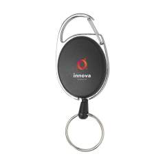 Card holder with roll-off mechanism and recoil system. Made from metal combined with ABS plastic. The roller clip features a key ring and a carabiner. The 60 cm pull-out cord allows easy use of access cards, badges or keys. Clip the holder to your trousers or bag and pass your access card past the scanner in one movement. Perfect for use in offices, fairs, conferences or even on the ski slope.