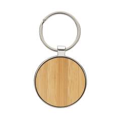 Ronde sleutelhanger gemaakt van RCS-gerecycled zinc alloy en bamboe. Totaal gerecycled materiaal: 73% op basis van het totale gewicht van het item. RCS-certificering zorgt voor een volledig gecertificeerde toeleveringsketen van de gerecyclede materialen. Verpakt in papieren zak