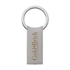 Porte-clés en métal mat avec anneau solide et système à cliquet pratique. Chaque article est  fourni dans une enveloppe individuelle en papier kraft marron.