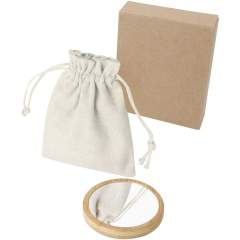 Miroir rond en bambou pour une touche naturelle et élégante. Livré dans une pochette en coton.
