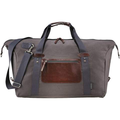 Exclusive design duffel, made of cotton canvas, features a large main compartment and unique Field & Co.™ details. Vinyl accents, front zippered pocket and durable handles. Sides can clip down when you are carrying less, or you can unclip the sides when the bag is fully stuffed. Also features trolley pass-through.