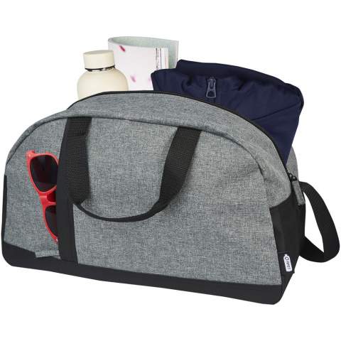 The Reclaim GRS recycled two-tone sport duffel bag is made from 100% recycled materials on the exterior, and it features a vertical zippered front pocket and a roomy zippered main compartment. Webbing wrapped carry handles and adjustable shoulder straps for your carrying comfort, making it suitable for sport activities.  