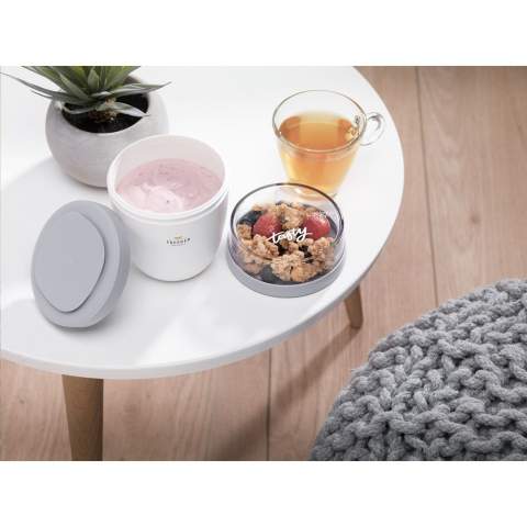 This plastic food jar made by Mepal is a handy product for transporting your lunch or snack. The food jar has two compartments. You can separate the two with a twisting motion. Both parts have a separate lid. The ideal solution for preventing spills while mixing. The volume of the upper transparent compartment is 200 ml, which means that it holds about 75 grams of muesli or fruit. The volume of the bottom compartment is 500 ml, enough for a generous portion of soup, noodles or yoghurt. A premium high-quality product. BPA-free, Food Approved and leak-proof. Microwave safe (except lid) and freezer safe. Comes with a 2-year Mepal manufacturer's warranty. Made in Holland.   STOCK AVAILABILITY: Up to 1000 pcs accessible within 10 working days plus standard lead-time. Subject to availability.