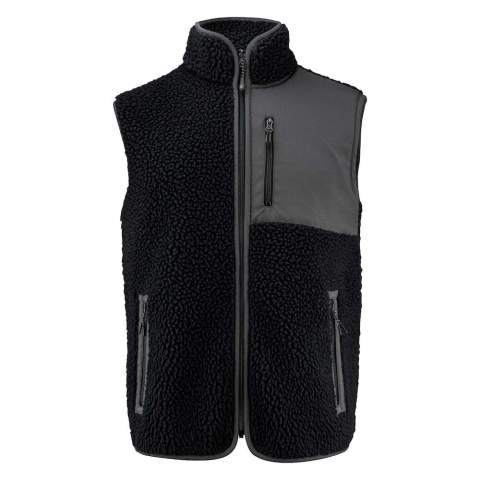 Bicolor teddy fleece bodywarmer. Contrasterende stof op de linkerborst en als afwerking van de naden. Borstzak en zijzakken met ritssluiting. Dit artikel is verpakt in een composteerbare polybag.