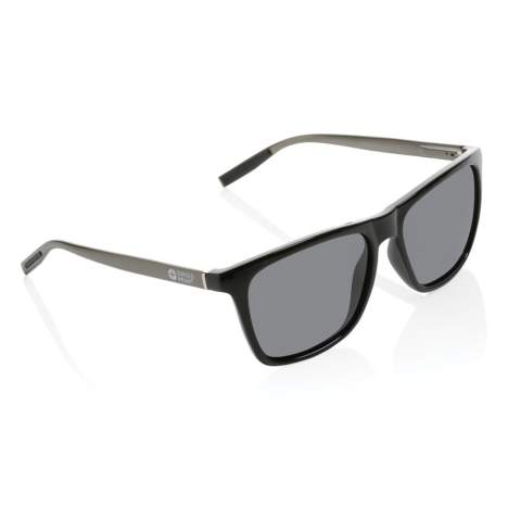 Luxury polarised sunglasses made with RCS certified recycled PC frame and aluminum temples. Total recycled content: 37% based on total item weight. RCS certification ensures a completely certified supply chain of the recycled materials. Including GRS certified recycled RPET sleeve to store the glasses in.The lenses are polarised which eliminates reflecting sunlight, making it ideal for driving a car or during other sunny summer or winter outdoor activities. Conform EN ISO 12312-1, UV 400 and CAT 3. Packed in a FSC® gift packaging.