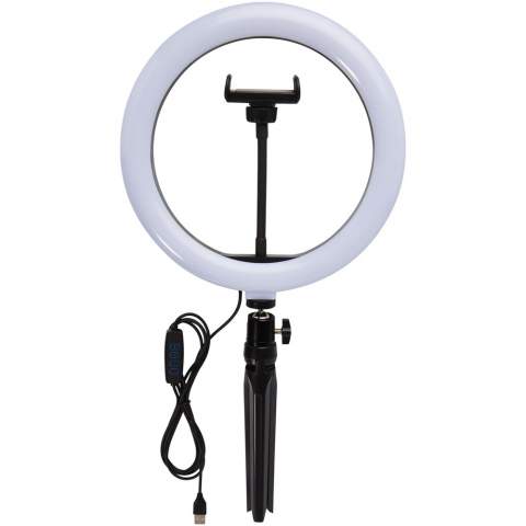 LED ring light (23 cm) with a tripod stand and phone holder, the ideal gadget for any photographer/YouTuber/Vlogger/content creator that regularly do streams or broadcasts. The ring light will cast even light on your face without any hard shadows. The lamp has 120 warm white LEDs that can be adjusted to 10 different brightness levels for the perfect light exposure. Delivered in an Avenue gift box.