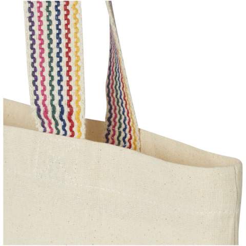 Die Rainbow Tragetasche mit 180 g/m² ist ein echtes Upgrade zur normalen Baumwolltragetasche. Diese Einkaufstasche aus Recyclingbaumwolle und -polyester ist hergestellt aus Produktionsresten und hat 25 cm lange Tragegriffe aus regenbogenfarbenem Gurtband und eine 3,5 cm breite Standfläche. Sie bietet somit mehr Stauraum. Belastbar bis zu 5 kg.