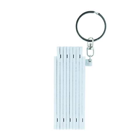 Foldable white mini ruler on a keyring. Length of 0.5 meters.