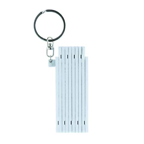 Foldable white mini ruler on a keyring. Length of 0.5 meters.