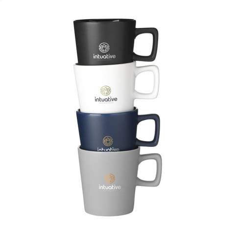 Modern mug made from high-quality ceramic and 5% recycled ceramic. The handle has an angular shape, creating an eye-catching design feature. The outside of the mug has a chic matte finish, the inside is finished in high gloss. Dishwasher-safe. Capacity 290 ml. NOTE: The white mug cannot be laser engraved because it is not sufficiently visible. Recycled ceramic mugs are manufactured by mixing raw materials with fragments of broken or unusable mugs collected in the same factory. These discarded components are finely ground into powder and then mixed with essential substances such as kaolin and quartz before being converted into new ceramic products. The final product usually consists of 5% to 10% recycled ceramics to ensure optimal quality. The use of recycled ceramics promotes the circular economy and reduces the need for new raw materials.