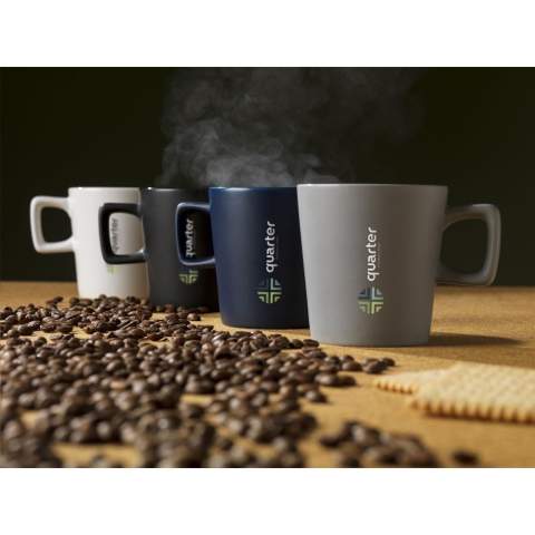 Modern mug made from high-quality ceramic and 5% recycled ceramic. The handle has an angular shape, creating an eye-catching design feature. The outside of the mug has a chic matte finish, the inside is finished in high gloss. Dishwasher-safe. Capacity 290 ml. NOTE: The white mug cannot be laser engraved because it is not sufficiently visible. Recycled ceramic mugs are manufactured by mixing raw materials with fragments of broken or unusable mugs collected in the same factory. These discarded components are finely ground into powder and then mixed with essential substances such as kaolin and quartz before being converted into new ceramic products. The final product usually consists of 5% to 10% recycled ceramics to ensure optimal quality. The use of recycled ceramics promotes the circular economy and reduces the need for new raw materials.