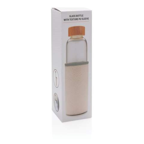 This glass bottle with textured PU sleeve is an ideal solution for those who prefer a plastic-free drinking experience. It's made of glass and features a leak-proof bamboo lid. A wide-mouth design that allows for easy liquid intake, and a nonslip PU sleeve to protect the glass bottle while adding a fashionable touch. Capacity 550ml.