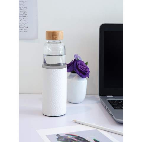 This glass bottle with textured PU sleeve is an ideal solution for those who prefer a plastic-free drinking experience. It's made of glass and features a leak-proof bamboo lid. A wide-mouth design that allows for easy liquid intake, and a nonslip PU sleeve to protect the glass bottle while adding a fashionable touch. Capacity 550ml.