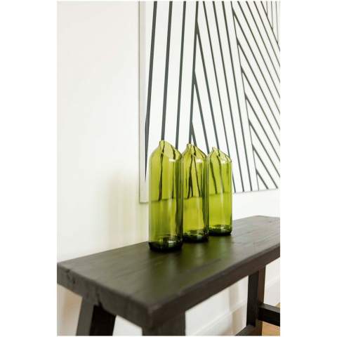 Handcrafted 750 ml water carafe made from upcycled wine bottles from Zanzibar, Tanzania. The wine bottles are collected from hotels, restaurants, and bars, and then they are sorted, cleaned, and cut into different shapes and sizes. Delivered in a gift box.
