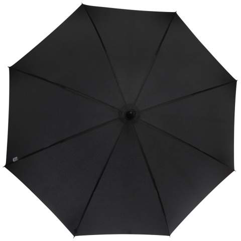 Automatic opening umbrella with a pongee polyester canopy, and a sturdy black plated metal shaft. The high quality full fiberglass frame offers maximum flexibility in windy conditions. Crooked handle with a carbon look finish and black nickel plated tips. Luxe branded details on woven label on the canopy and the closure strap. Large decoration area on each of the panels.