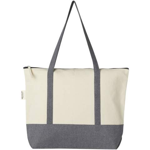 The Repose 320 g/m² recycled cotton zippered tote is made from eco-friendly, pre-consumer recycled cotton. Featuring a zippered main compartment, on-trend colour blocking, front slash pocket and 27 cm handles. Resistance up to 10 kg weight.