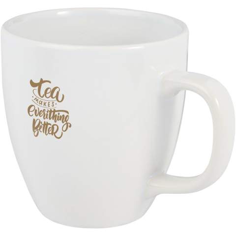 The Moni ceramic mug has a trendy glossy finish adding a sleek touch. It features a large handle that provides a comfortable and sturdy grip. The mug is versatile enough to use with both hot and cold beverages allowing you to enjoy coffee, tea, soup, and more.  Volume capacity is 430 ml. Dishwasher safe for all printing methods. Presented in a recycled cardboard gift box.