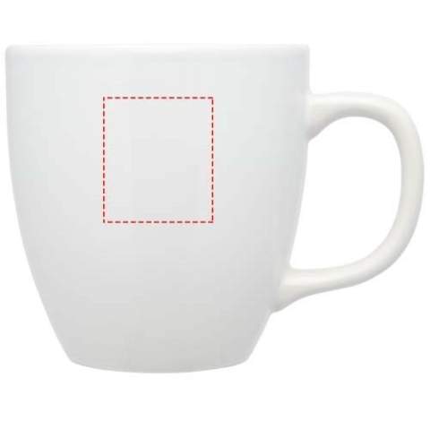 The Moni ceramic mug has a trendy glossy finish adding a sleek touch. It features a large handle that provides a comfortable and sturdy grip. The mug is versatile enough to use with both hot and cold beverages allowing you to enjoy coffee, tea, soup, and more.  Volume capacity is 430 ml. Dishwasher safe for all printing methods. Presented in a recycled cardboard gift box.