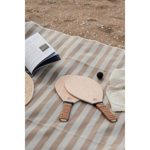 An elegant beach tennis set, made of poplar wood with PU handles for a more comfortable grip. A game that is easy to learn and suitable for young and old alike. Includes two rackets and two rubber balls, packaged in a cotton bag that makes it easy to carry with you. This game is designed solely for use on dry surfaces and is not intended for use in the water.
