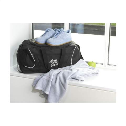 Large sports/travelling bag made of 600D polyester. With front pocket with zipper, mesh pocket, 2 handles and an adjustable shoulder strap. Capacity approx. 22 litres.