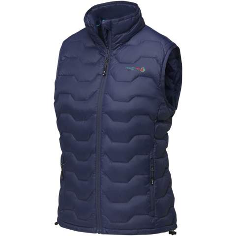 The Epidote women's GRS recycled insulated bodywarmer – a sustainable and stylish outerwear choice for environmentally-conscious adventurers. Crafted with precision and care, this bodywarmer is fully GRS certified, making it a more sustainable addition to your wardrobe. Designed for comfort and warmth, the honeycomb quilted pattern shows a modern design and enhances insulation, while the GRS certified recycled nylon dull cire 380T woven fabric provides durability and weather resistance. Even the trims and accessories, including zippers, are thoughtfully sourced from recycled materials, ensuring every aspect of this bodywarmer contributes to a greener planet. Equipped with practical features, the Epidote bodywarmer has front pockets with zippers and an inside left bottom pocket for secure storage. The inner stormflap with chin guard shields you from the elements, while the elastic drawstring with adjustable cord lock in the bottom hem allows for a customised fit. The elastic binding on the hood ensures added protection against cold winds. The RDS certified recycled feathers provides warmth without compromising on ethical standards. With GRS certification guaranteeing a 100% certified supply chain, this garment truly represents an environmentally conscious choice. This bodywarmer is designed with a fitted shape for a feminine look.