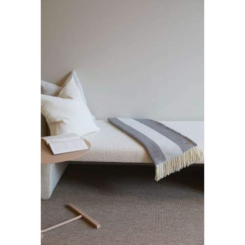 With its timeless design and classic broad-striped pattern, it seamlessly complements any home decor. Crafted from a blend of 60% Polylana® and 40% acrylic, this blanket provides exceptional softness and ensures you stay warm and comfortable. Features the AWARE™ tracer technology, validating the genuine use of recycled materials. 2% of the proceeds of each product sold will be donated to Water.org.