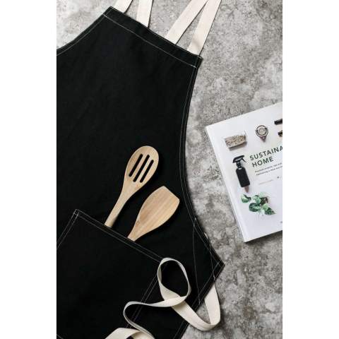 Apron made from 70% certified recycled cotton from suppliers' cotton waste. Fibres that are usually considered unusable have, with the appropriate manufacturing process, achieved the desired properties. This apron is extra wide to provide maximum protection. Two large front pockets and a loop for hanging utensils or a tea towel.