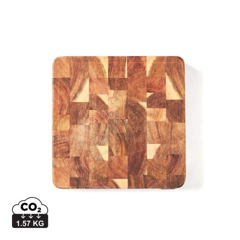Cutting board in beautiful FSC-certified acacia wood. Excellent for serving. Due to the beautiful grain of the acacia wood, each cutting board is unique. With grooves on the short sides to enable a better grip. Acacia wood is a durable material that will last for many years. This cutting board is made of end-grain wood which requires considerably more production, as the pieces of wood have to be glued and paired together in such a way that the board will not warp over time. The result is a very exclusive cutting board, one of the very best you can own. With proper care, it will last a long time.