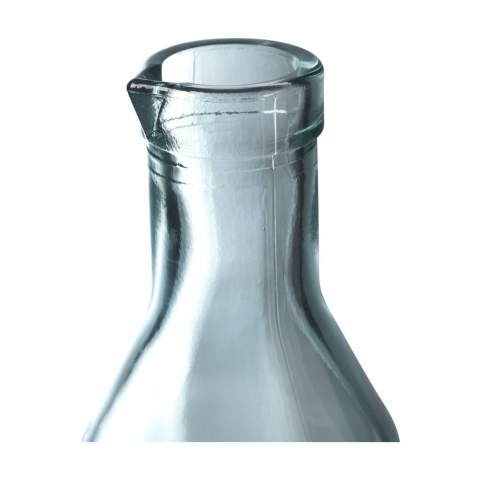 WoW! Decorative water bottle with spout. Made from 100% recycled, robust quality glass. Closes with a cork cap. An attractive bottle with character. The glass is embossed with the 'Authentic Glass 100% recycled' label.     The blue-green tint of this glass is a natural result of the recycling process. The colour and any imperfections emphasise the beauty of this recycled product and contributes to its authenticity. Recycling reduces the consumption of new raw materials, water and energy. Colour, thickness and size may vary by product. Made in Spain. Capacity 1,200 ml.