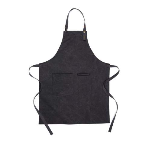 Apron made from 87% verified recycled material. This stylish apron is a practical kitchen accessory with a wonderful design. The apron has a pocket on the front and a loop for hanging utensils or kitchen towels, so you have everything to hand when you're in the middle of cooking. The apron has a soft and adjustable neck strap for increased comfort. Made from GRS (Global Recycled Standard) certified recycled materials. GRS certification ensures a fully certified supply chain of the recycled materials. Total recycled content is based on total product weight. This product contain 87% recycled cotton/polyester.