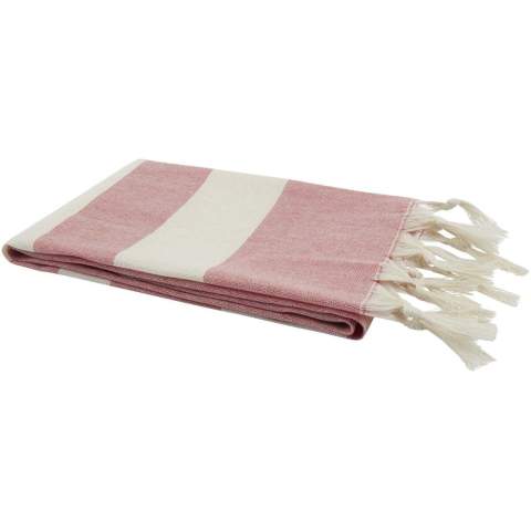 The Anders hammam towel provides luxurious comfort with generous dimensions (147 x 75.5 cm), ensuring plenty of coverage whether you're lounging by the pool or enjoying a day at the beach. The towel has elegant tassels at both ends, and is made of 30% cotton, 35% GRS certified recycled cotton and 35% GRS certified recycled polyester, 180 g/m².
