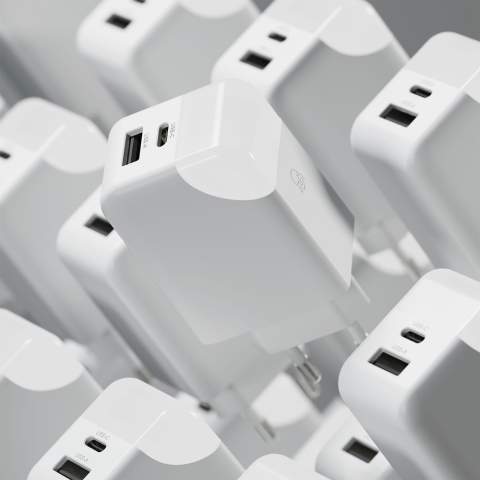 This 65W GaN power adapter is designed for fast and efficient charging of laptops, tablets, and smartphones. It features a USB-A port with up to 18W output and a Type-C port with up to 65W output. When both ports are used simultaneously, it provides a max of 9W output per port. The smart charging indication light not only shows the charging status but also turns off once the device is fully charged, and can be manually switched off by touching. The compact and practical design makes it easy to use.  It is made from anti-fire recycled plastic ensuring safety and sustainability. Whether you're at home, in the office, or on the go, this adapter is a reliable power solution for all your devices.