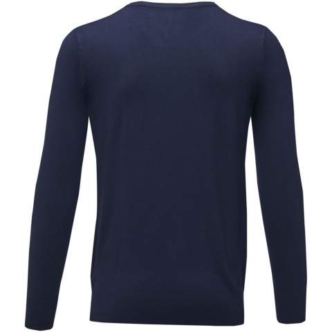 The Stanton men's v-neck pullover – a perfect blend of sophistication and a classic v-neck design. The flat knit rib collar, cuffs, and bottom hem not only elevate its aesthetic appeal but also offer lasting comfort. Made from a blend of viscose and nylon in a 12-gauge flat knit, this pullover strikes the perfect balance between style and functionality. This fine gauge results in a fabric that's smoother and more refined, perfect for both formal occasions and elevating your everyday ensemble.
