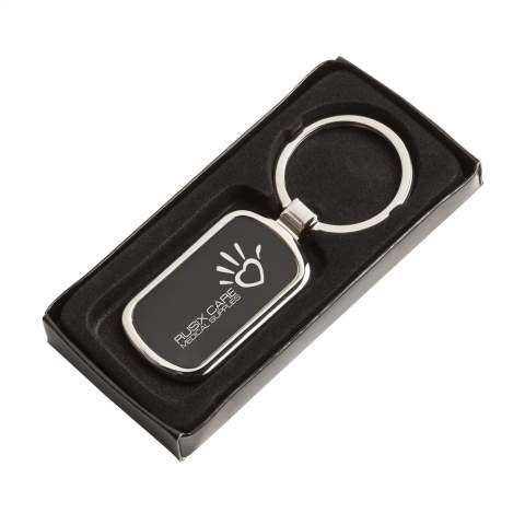 A rectangular, polished, nickel metal keyring with black inlay and sturdy keyring. Each item is individually boxed.