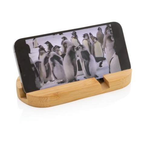 Phone stand made from completely natural bamboo. Perfect on your desk or when you are working from home. The stand can hold most mobile devices and tablets.  The shorter groove is optimized for mobile phones and the longer one for tablets.