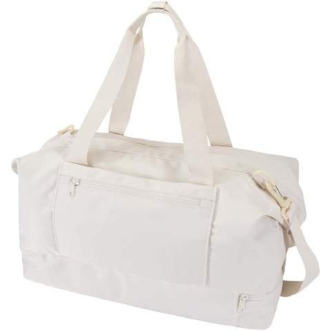 The Trip Aware™ recycled travel duffel bag is a versatile and spacious companion, ideal for short getaways and carrying all your essentials with ease. Made from durable 290D twill polyester with a soft knitted backing and lined with RPET 210D/PU, it is designed for practical use and comfort. The main compartment includes a large zipped pocket with dedicated storage for a passport, pens, and a key ribbon, along with two internal slide pockets and dual water bottle holders. A separate bottom compartment opens in a clamshell style, perfect for storing shoes or separating gear. Each bag also comes with an Aware™ tracer. This innovative feature allows users to trace the origins and journey of their item through a QR code, enhancing transparency in the supply chain and fostering a stronger connection between the product and its production process. Volume capacity: 42 litres.