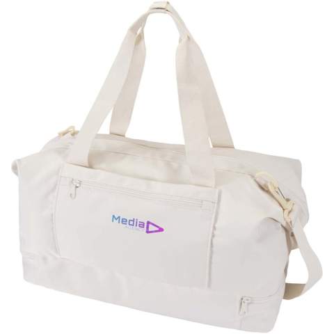 The Trip Aware™ recycled travel duffel bag is a versatile and spacious companion, ideal for short getaways and carrying all your essentials with ease. Made from durable 290D twill polyester with a soft knitted backing and lined with RPET 210D/PU, it is designed for practical use and comfort. The main compartment includes a large zipped pocket with dedicated storage for a passport, pens, and a key ribbon, along with two internal slide pockets and dual water bottle holders. A separate bottom compartment opens in a clamshell style, perfect for storing shoes or separating gear. Each bag also comes with an Aware™ tracer. This innovative feature allows users to trace the origins and journey of their item through a QR code, enhancing transparency in the supply chain and fostering a stronger connection between the product and its production process. Volume capacity: 42 litres.