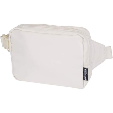 The Trip Aware™ recycled travel crossbody bag is a compact and functional bag designed for daily use and light travel. Made from durable 290D twill polyester with a knitted backing and lined with RPET 210D/PU, it features a clean, streamlined shape with practical storage options. The main zipped compartment holds your everyday essentials, while the back zipped pocket includes a ribbon for keys, as well as dedicated slots for pens and a passport. The adjustable strap with buckle ensures a secure and comfortable fit during movement. Each bag also comes with an Aware™ tracer. This innovative feature allows users to trace the origins and journey of their item through a QR code, enhancing transparency in the supply chain and fostering a stronger connection between the product and its production process. Volume capacity: 1 litre.